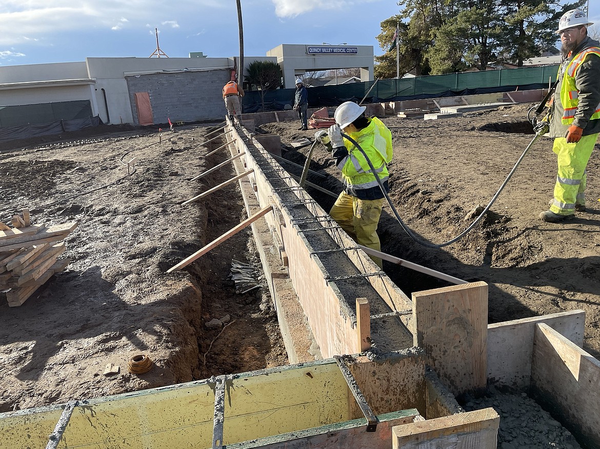 Construction and concrete crews pour the footings for the new Quincy Valley Medical Center in December.