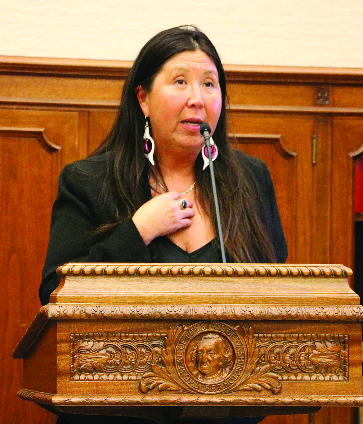 Rep. Debra Lekanoff, D-Bow, addresses a crowd at a press conference in Olympia. With tribal leaders, Lekanoff is pressing for state help to counter the opioid crisis among tribal communities. Photo by Aspen Anderson