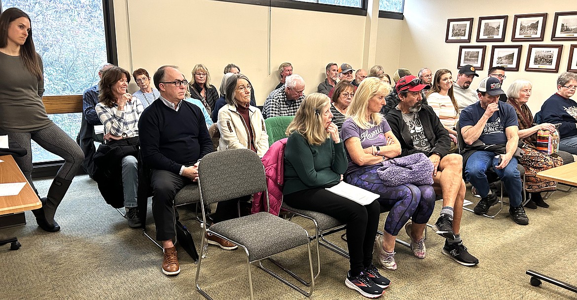 Residents listen to plans for a Marriott hotel in downtown Coeur d'Alene during during Thursday's Design Review Commission meeting on Thursday at City Hall.