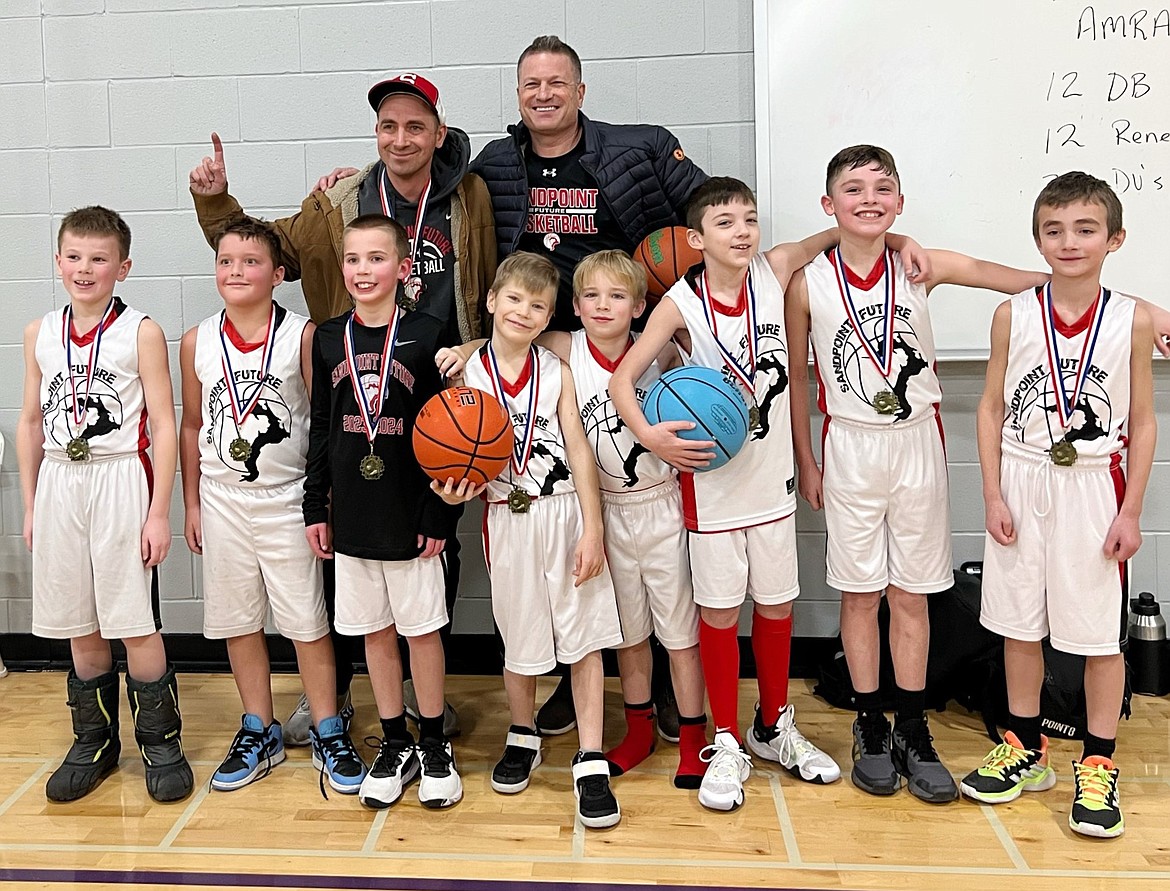 The Sandpoint Future third grade boys basketball team is all smiles after winning the 4th annual MLK Basketball Tournament in Lewiston. Pictured, from left,  Lincoln Marshall, Nash Oliver, Matthew Wilson, Hudson Haymond, Benji Munson, Liam Corbett, Gus Kuhn, and Wesley Franz. This year's coaches are Dan Franz (assistant) and Scott Marshall (head).