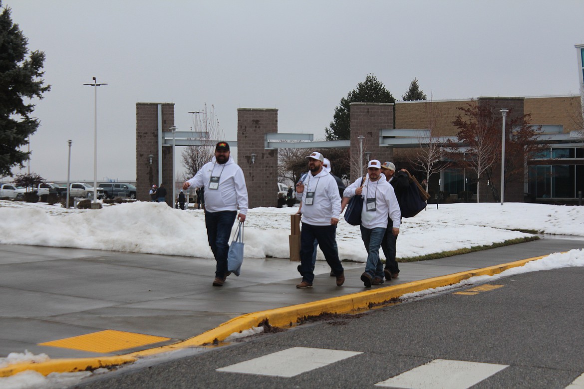 Bags of swag in hand, Washington-Oregon potato conference attendees take a lunch break