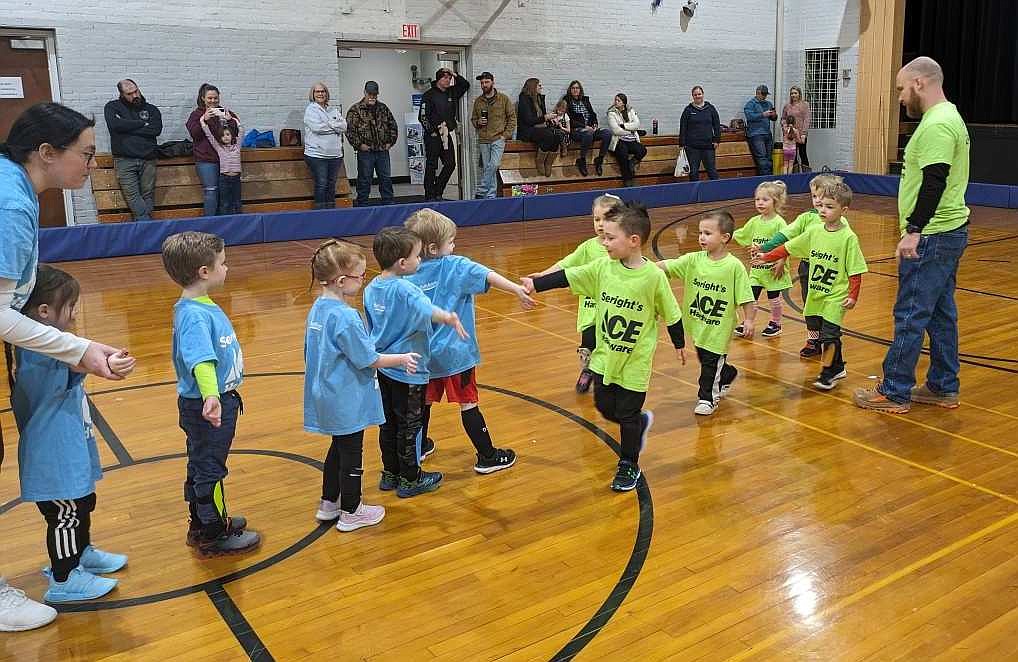 Courtesy photo
Players from the Yellow Pterodactyls, right, and Blue Raptors slap hands after a Rathdrum Parks and Rec indoor Winter Kickers 3-4-year-old age division soccer game at Mountain View Alternative High School. The league is sponsored by Seright’s Ace Hardware.