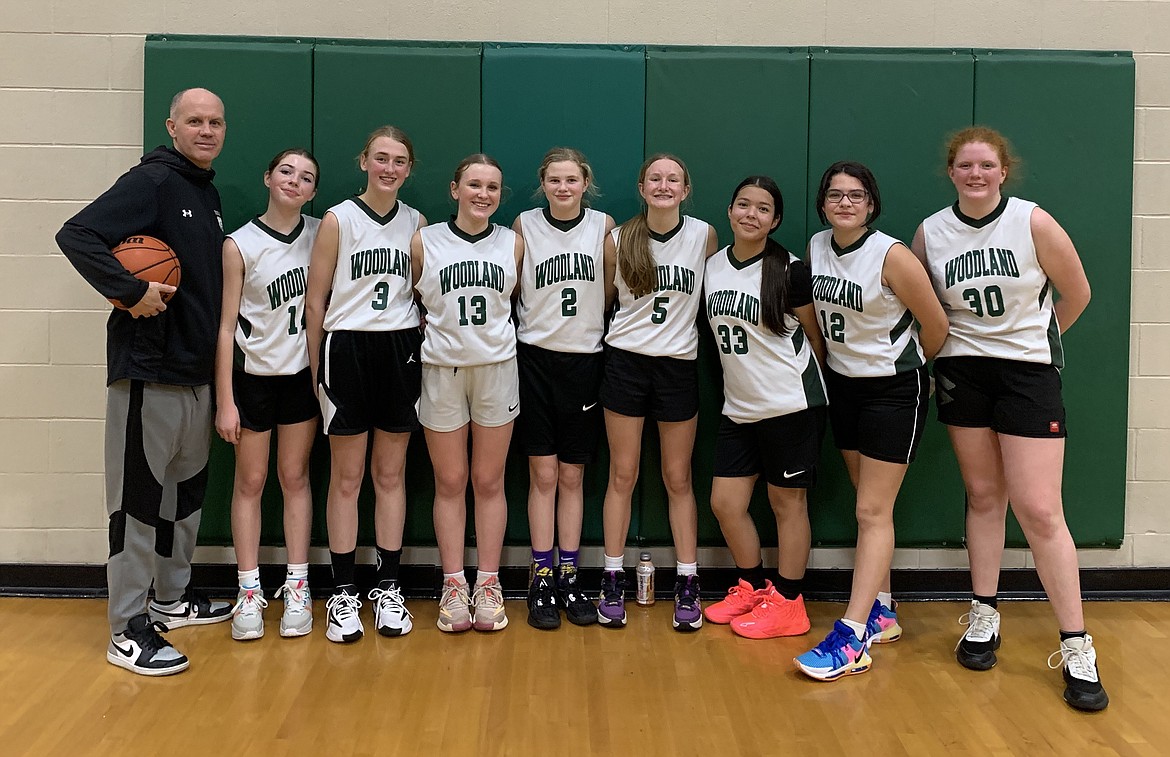 Courtesy photo
The Woodland Middle School seventh grade basketball "A" team finished 8-0 this season. From left are coach Bryce Johnston, Sophie Mathews, Payton Brown, Avree Bowman, Brynlee Johnston, Mckenna Wilson, Aralynn Abrahamson, Kailynn Doyle and Sierra Molinari.