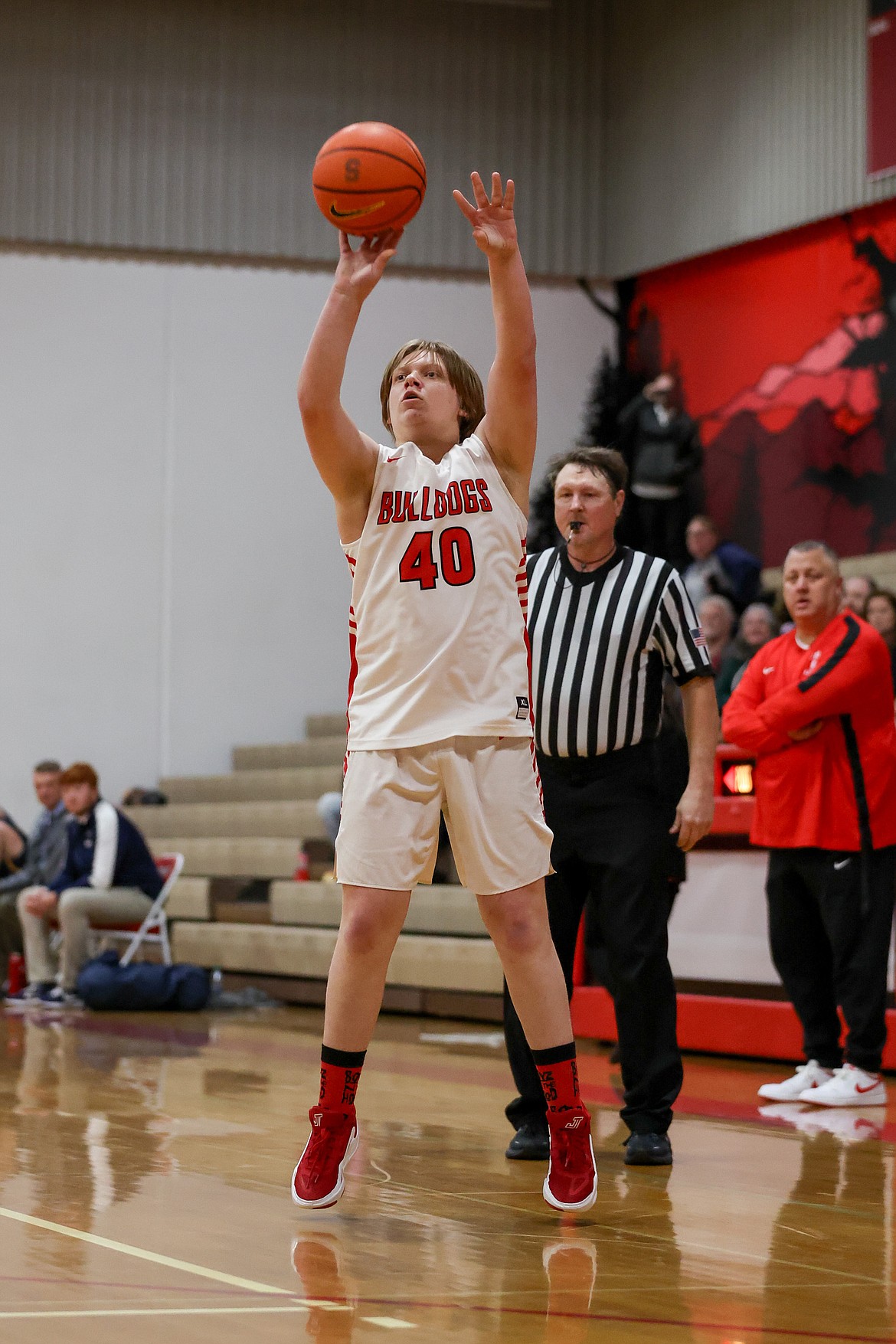 Sandpoint senior Evan Taylor drains a 3-pointer for the Bulldogs late in the fourth quarter on Friday night.