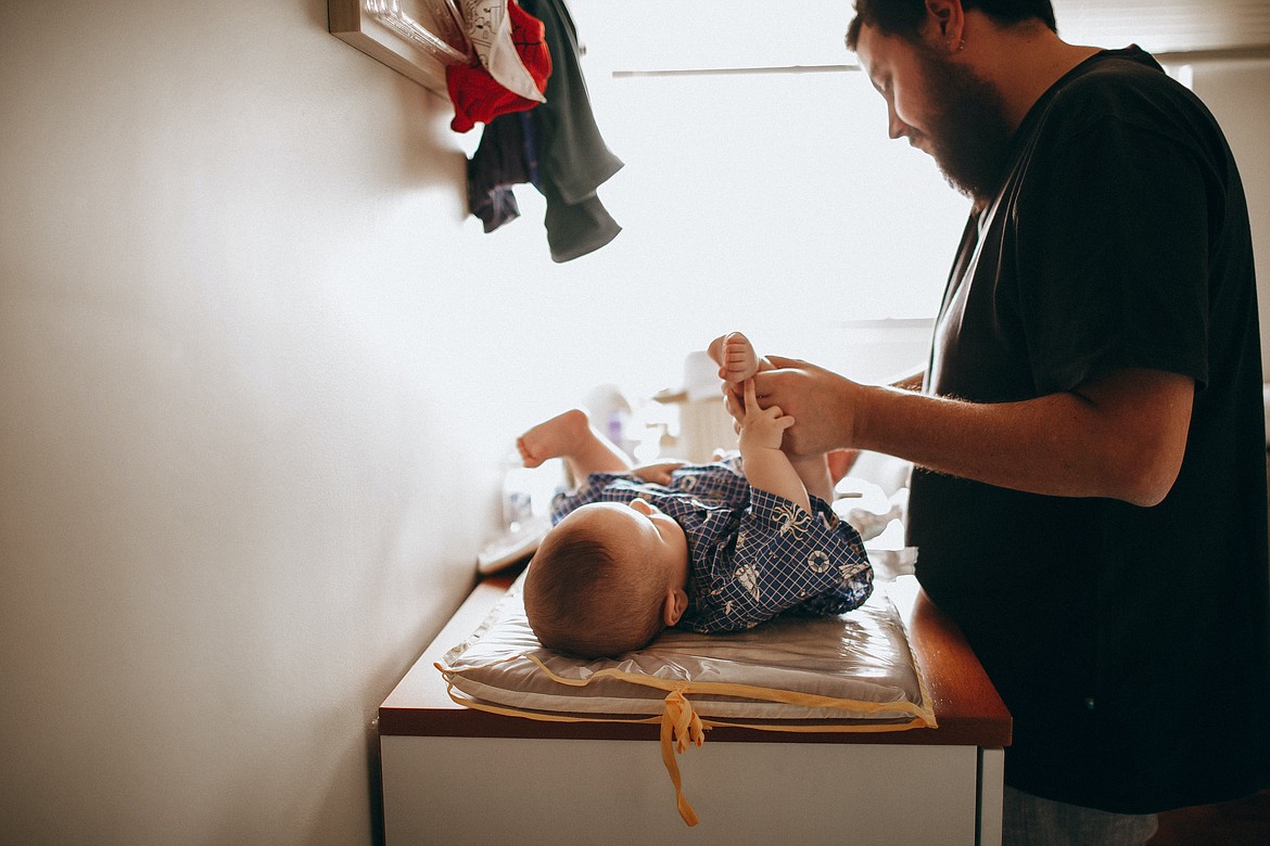 Finding a place to change a baby can be a challenge for fathers who are out and about with their infants. A bill being considered in Olympia might help with that.