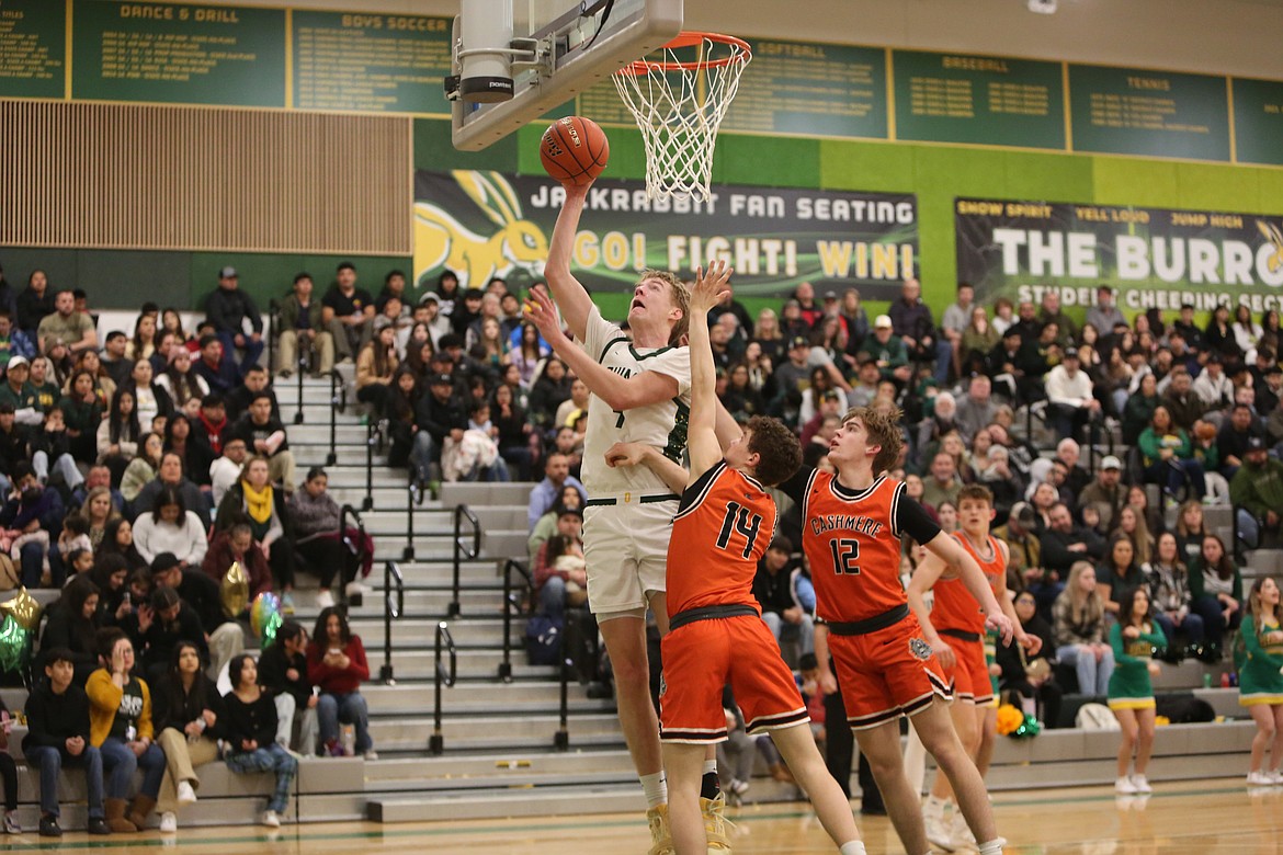 Quincy senior Aidan Bews, in white, scored 15 points in Thursday’s win over Cashmere.