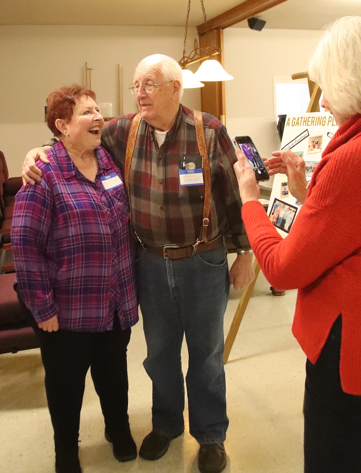 Kootenai Mayor Nancy Lewis and Dover Mayor George Eskridge laugh as they wait for Loris Michael, vice president of Sandpoint Area Seniors, Inc. board, to take their photo.