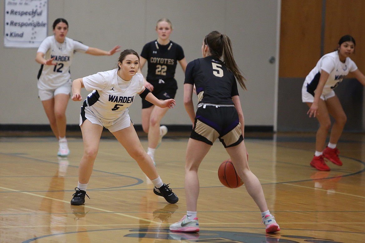 Warden senior Carina Martinez (5) defends a Columbia (Burbank) player in the first quarter of Friday’s win.