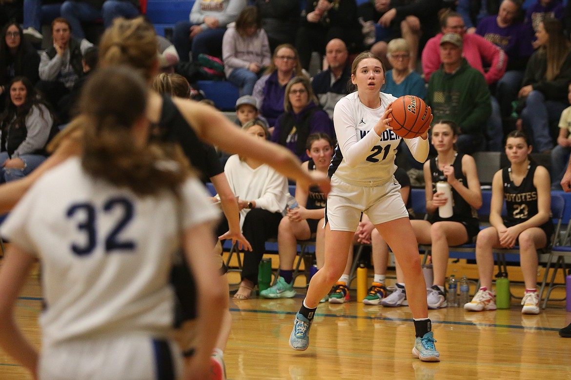 Warden freshman Makenna Klitzke (21) looks toward the basket in the first half against Columbia (Burbank).