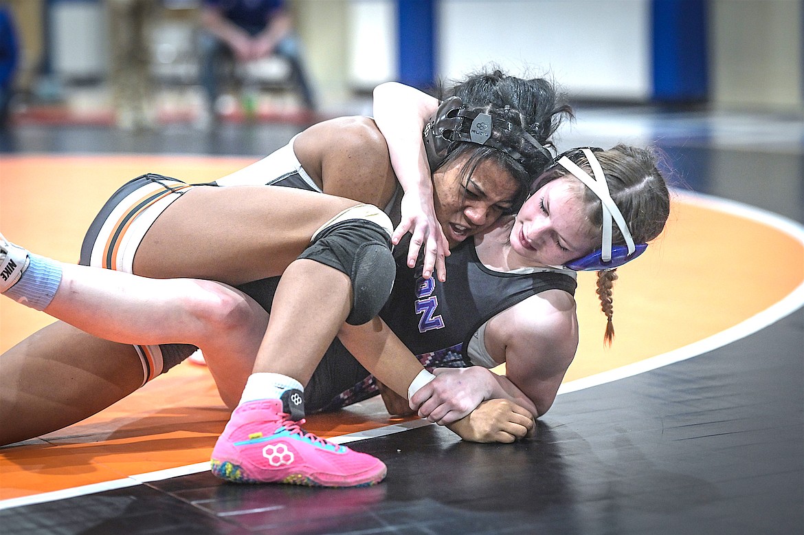 Aaliyah Stewart of Ronan tussles with Lyla Wanberg of Mission-Charlo during the Mission Mountain Classic in St. Ignatius Saturday. (Christa Umphrey photo)