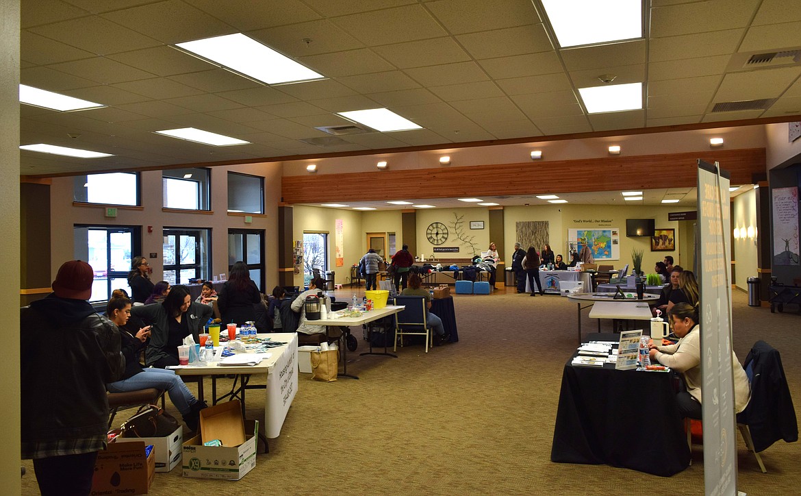 Booths set up by Columbia Basin agencies provide information and supplies during the Adams County Integrated Health Care Services Othello Matters outreach event Thursday. Event partners included various local healthcare and outreach organizations.