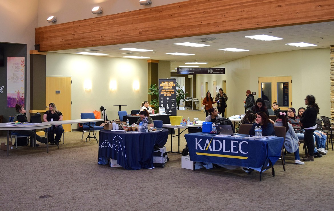 HopeSource and Kadlec Regional Medical Center booths sit inside the Othello Church of the Nazarene waiting to assist Othello community members during the Othello Matters outreach event Thursday.