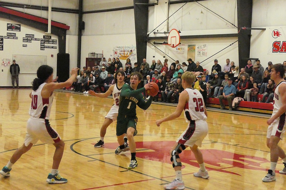 Tigers freshman guard Conner Lulis is surrounded by Hot Springs players as he looks for a passing lane during their game Thursday night in Hot Springs. (Chuck Bandel/VP-MI)