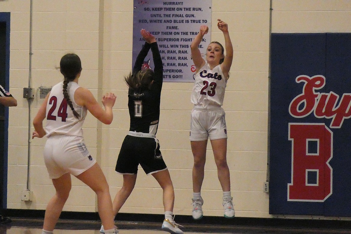 Superior sophomore Maggie Haworth (23) inbounds the ball over a Seeley player and into the hands of teammate Braelynn Mangold (24) during their game Saturday night in Superior.  (Chuck Bandel/MI-VP)