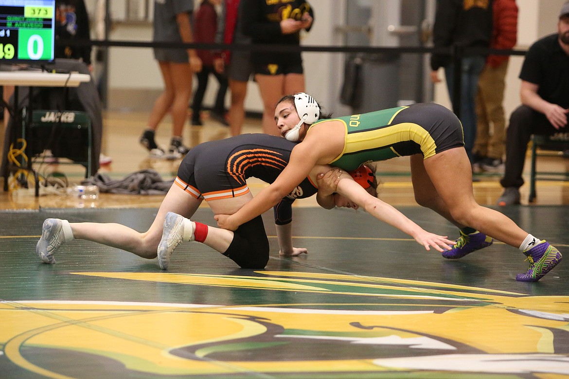 Quincy senior Michelle Acevedo won by a 2-1 decision in overtime of the 130-pound finals of Saturday’s Bring Home Da Beef girls wrestling tournament.