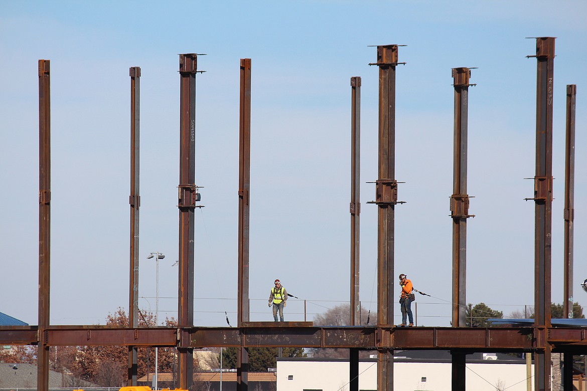 Construction workers walk the second-floor deck at the site of the new Samaritan Hospital. Voters approved funding for the new hospital last year after hospital district officials pointed out the need for expanded capabilities.