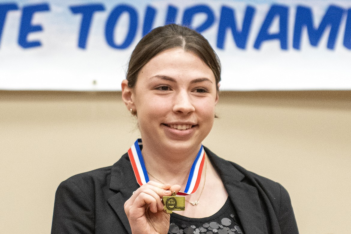 Kira Shanks shows off her first place medal for Memorized Public Address at the State A Speech Tournament in Columbia Falls Saturday, Jan 27. (Avery Howe photo)