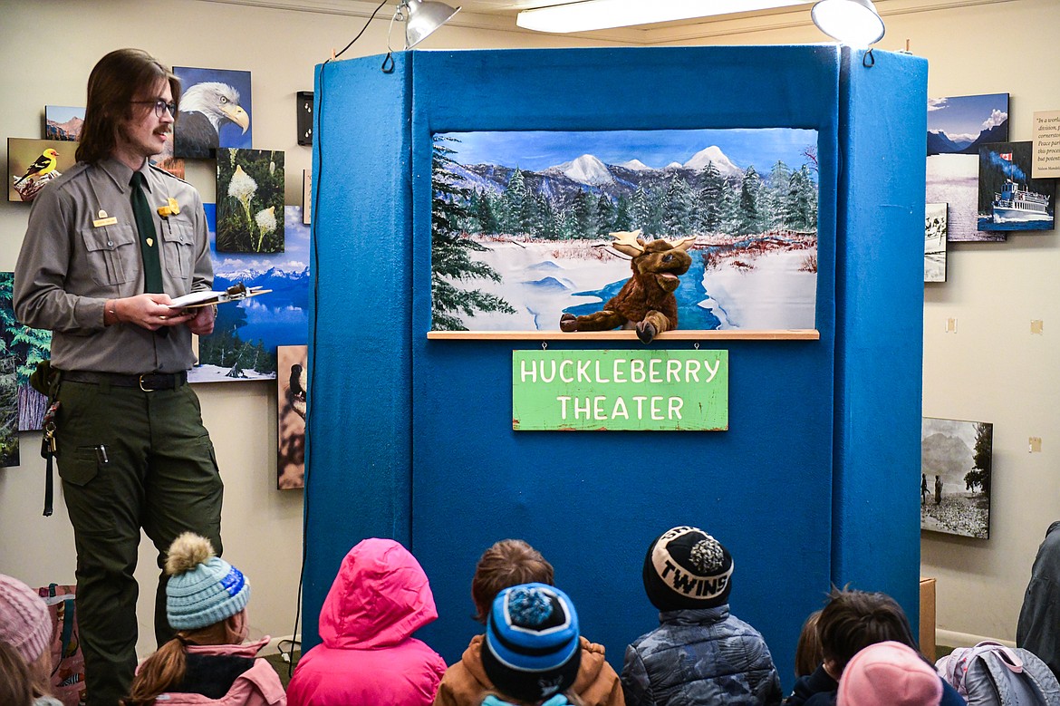Glacier National Park ranger Joseph Carlson leads a puppet show during an elementary school field trip at the Apgar Education Center on Tuesday, Jan. 30. (Casey Kreider/Daily Inter Lake)