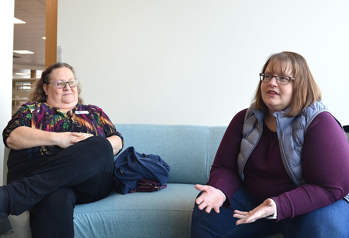 Assitant library director Mallory Witham and director Abbi Dooley take a break from moving in to the spacious and light-filled North Lake County Library to discuss it's many amenities. (Kristi Niemeyer/Leader)