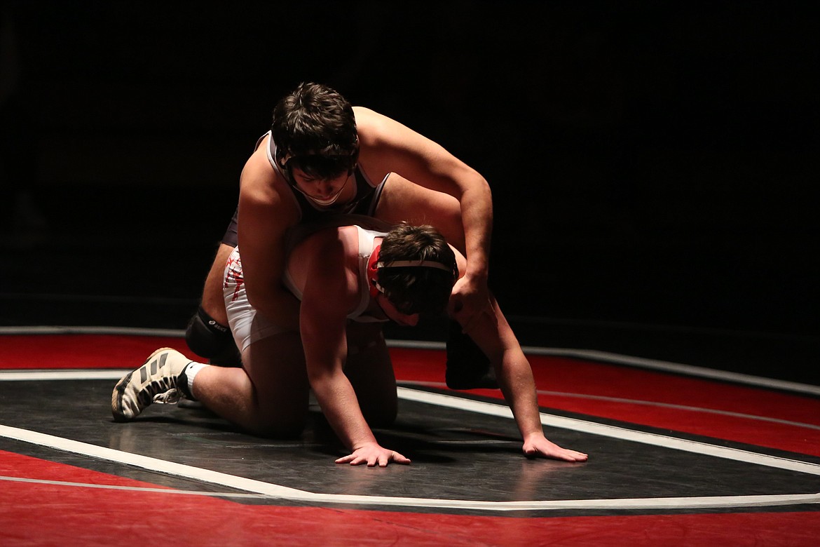 Othello senior Jesus Bonilla, background, works to flip his opponent during Othello’s dual against Prosser. The Huskies swept the CWAC in duals this season.