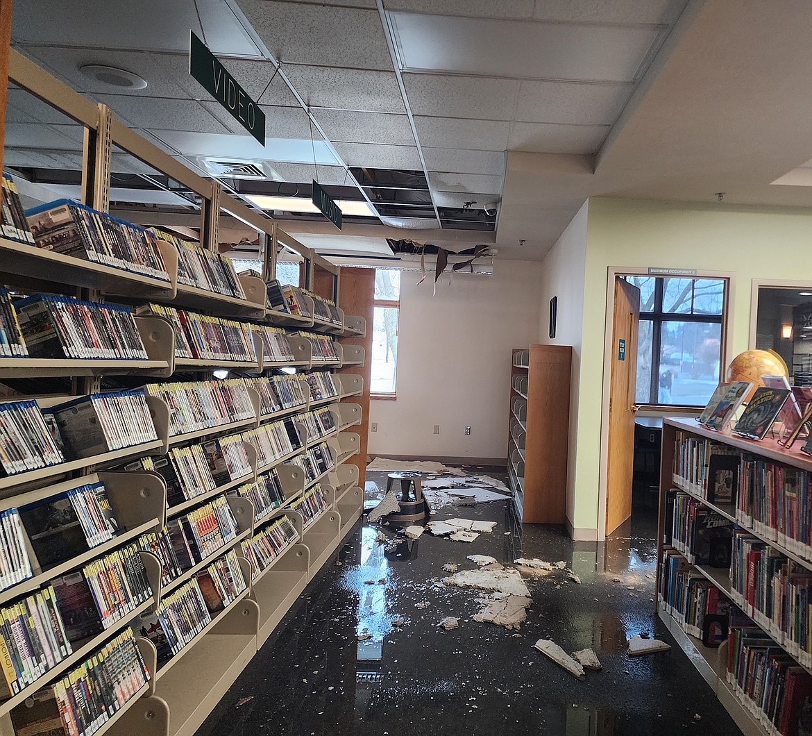 Water and pieces of ceiling are seen on the floor of the Post Falls Library in mid-January following weather-related damage. The Community Library Network's board of trustees will hold an emergency meeting at 2:45  p.m. Thursday during which insurance costs, emergency funds and staffing layoffs will be discussed.
