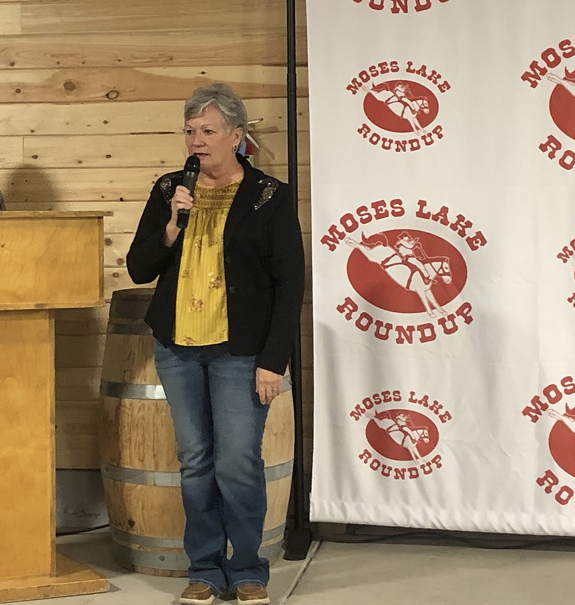 Marketing Director Sue Tebow greets sponsors and attendees at the 2024 Moses Lake Roundup annual banquet.