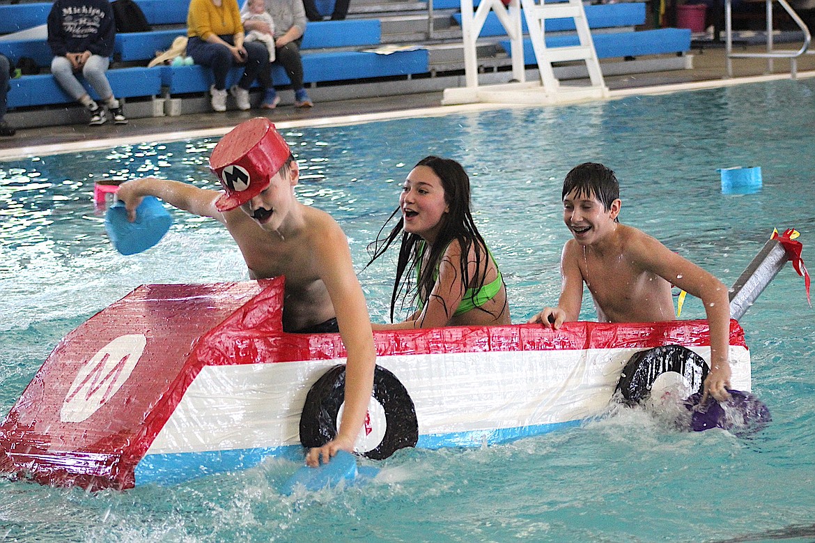 Polson eighth graders Carson Emerson, Cora Lapotka and Wyatt Moldenhauer wheel toward the finish line in last week's Duck Dynasty races. The threesome piloted Morrison's Marios over the finish line, earning their team the Pirate Pride Award. (Tami Morrison photo)