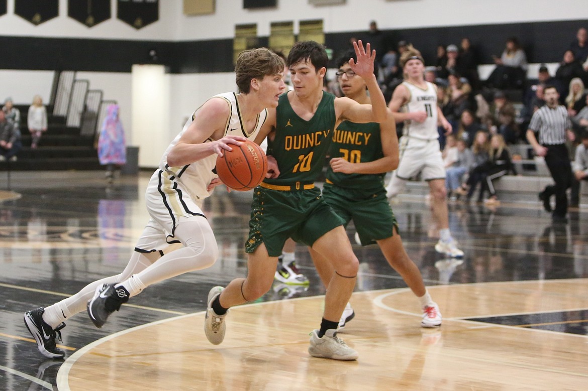 Royal senior Caden Allred drives toward the rim during a Jan. 13 game against Quincy.