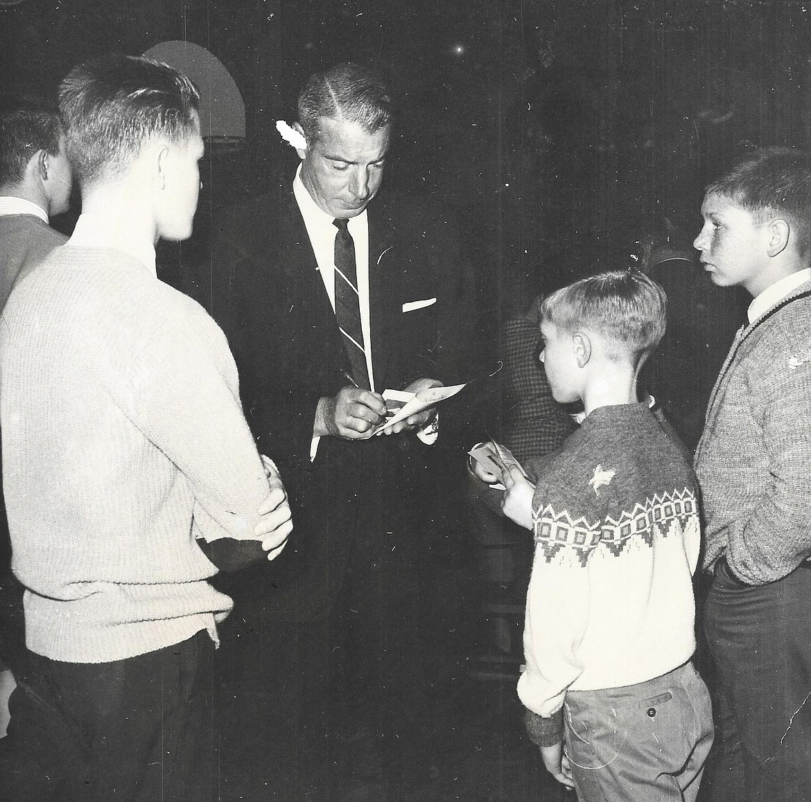 George Emmett of Coeur d’Alene, then 13, right, waits to get an autograph from New York Yankee great Joe DiMaggio.