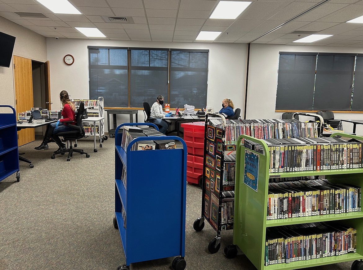Community Library Network staff members sort through items following mid-January weather damage that impacted the Post Falls and Athol Libraries. It is estimated repairs will cost near $1 million and will take up to six months to complete, Library Director Alexa Eccles reported Wednesday.