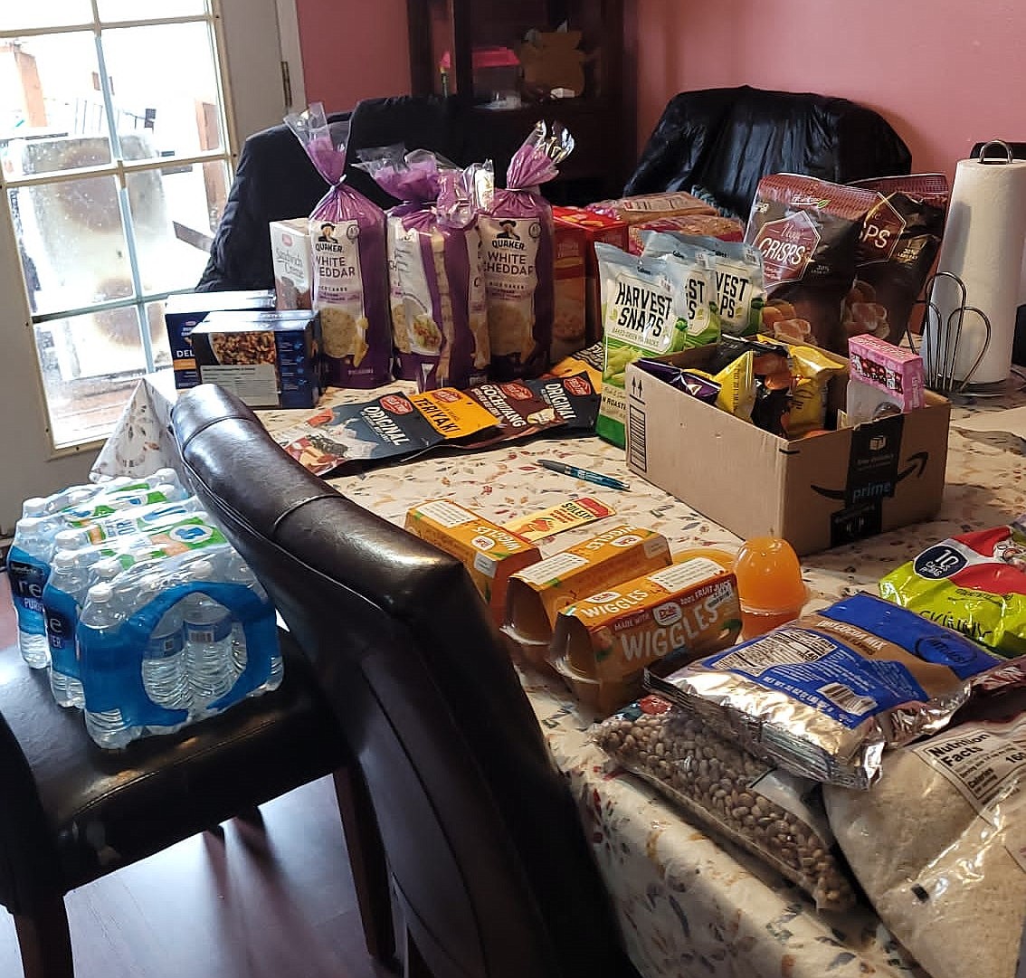 Food waits to be passed out to Othello community members in need as part of the “One Day at a Time” outreach program coordinated by Kadlec Community Health Worker Maria Perez.