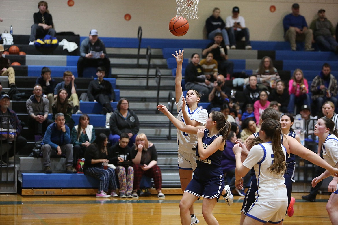 Soap Lake senior Olivia McCrady, left, attempts a shot in the fourth quarter against Cascade Christian.