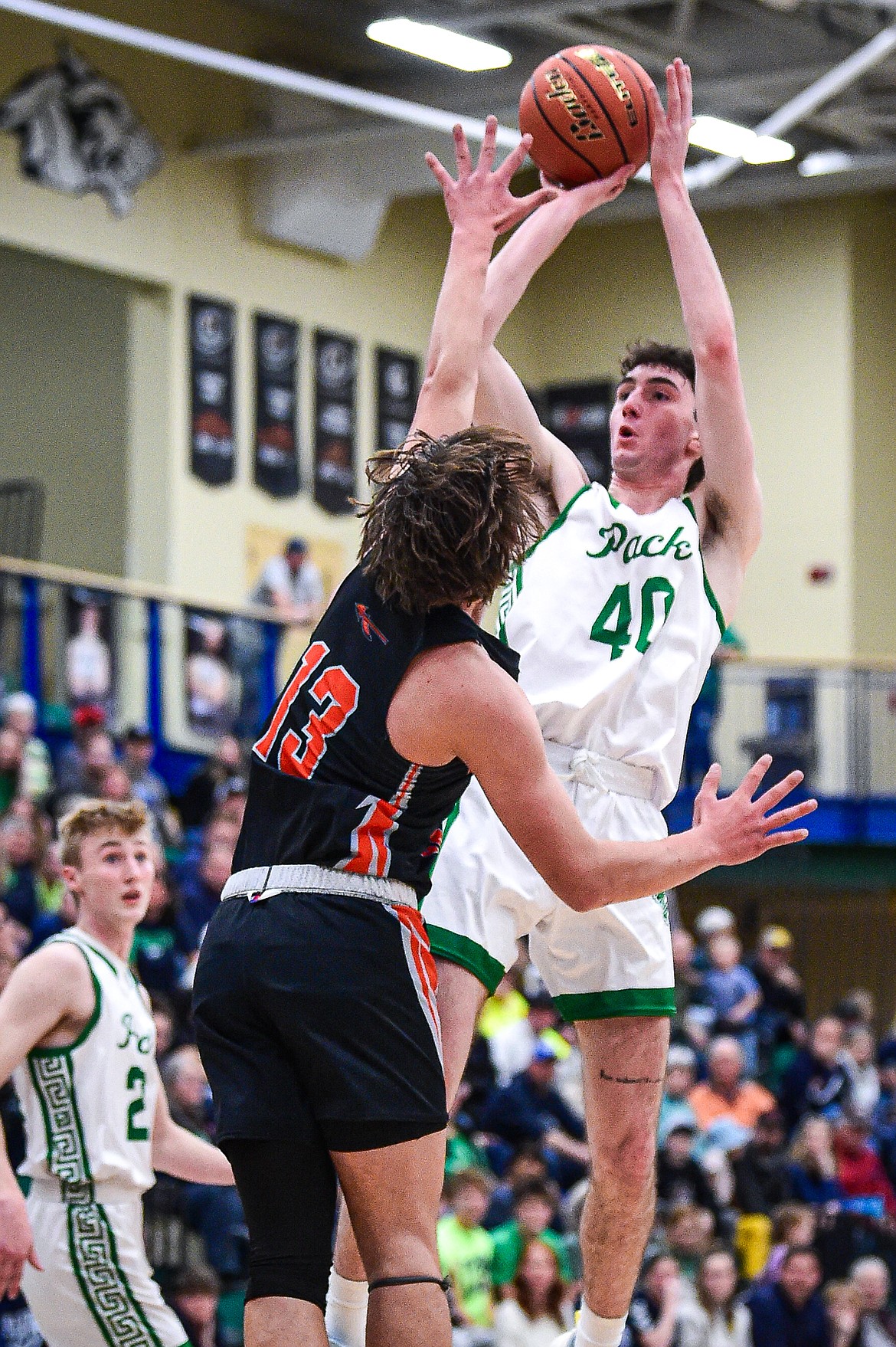 Glacier's Noah Cummings (40) shoots guarded by Flathead's Lyric Ersland (13) in the first half at Glacier High School on Thursday, Feb. 1. (Casey Kreider/Daily Inter Lake)