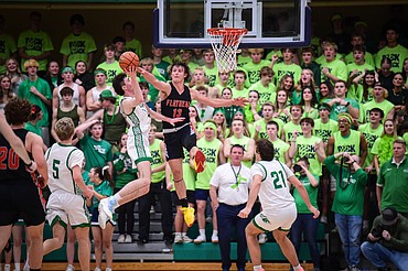 Glacier's Noah Cummings (40) is defended by Flathead's Lyric Ersland (13) on his way to the basket in the second half at Glacier High School on Thursday, Feb. 1. (Casey Kreider/Daily Inter Lake)
