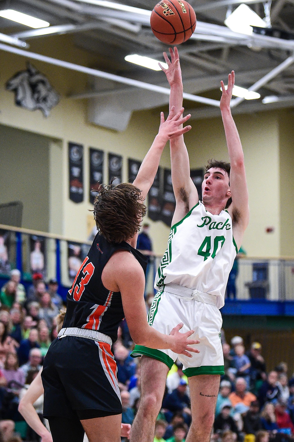 Glacier's Noah Cummings (40) shoots guarded by Flathead's Lyric Ersland (13) in the first half at Glacier High School on Thursday, Feb. 1. (Casey Kreider/Daily Inter Lake)