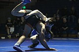 PREP WRESTLING: Trojans toughen up, down Vikings