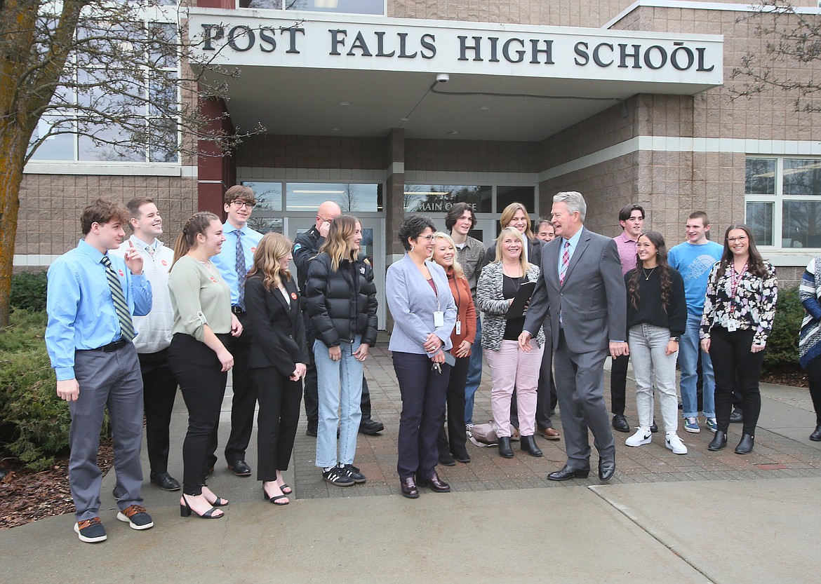 Idaho Gov. Brad Little, center right, shares a smile with Post Falls School District Superintendent Dena Naccarato, center left, Thursday morning as he says goodbye following a roundtable discussion with Post Falls, Timberlake and Lakeland high school students at Post Falls High.