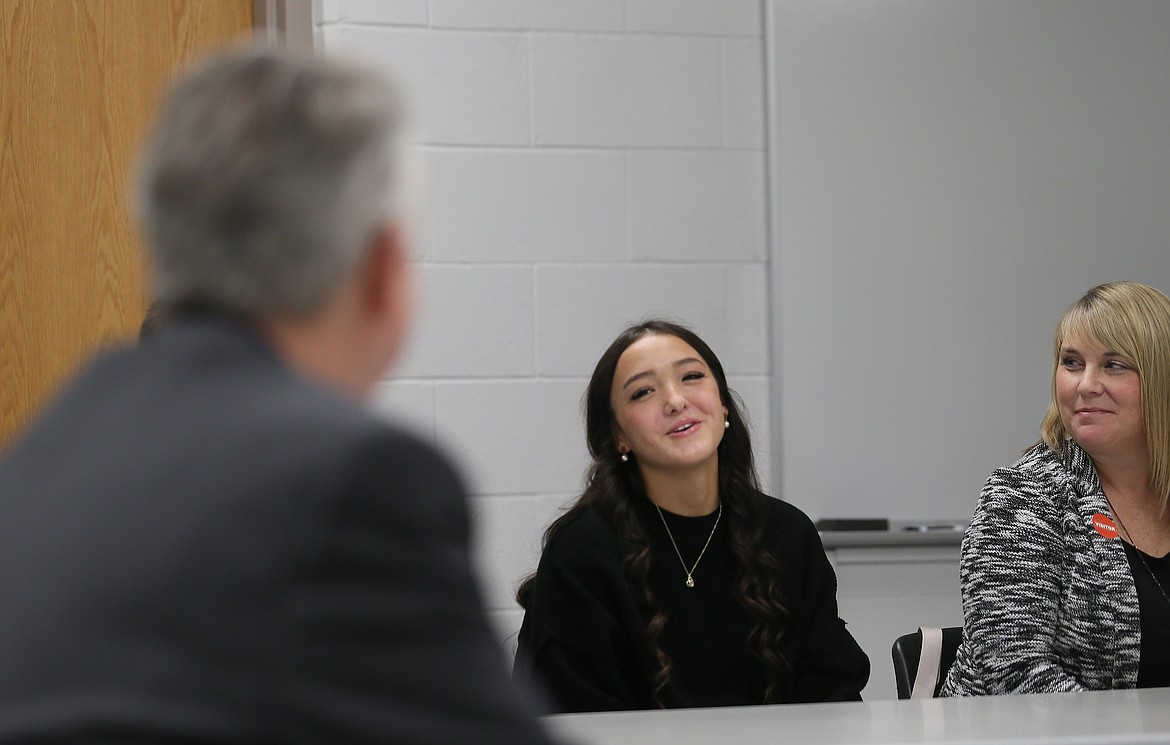 Post Falls High School senior Macy Uemoto speaks to Gov. Brad Little during a roundtable at the school Thursday morning.