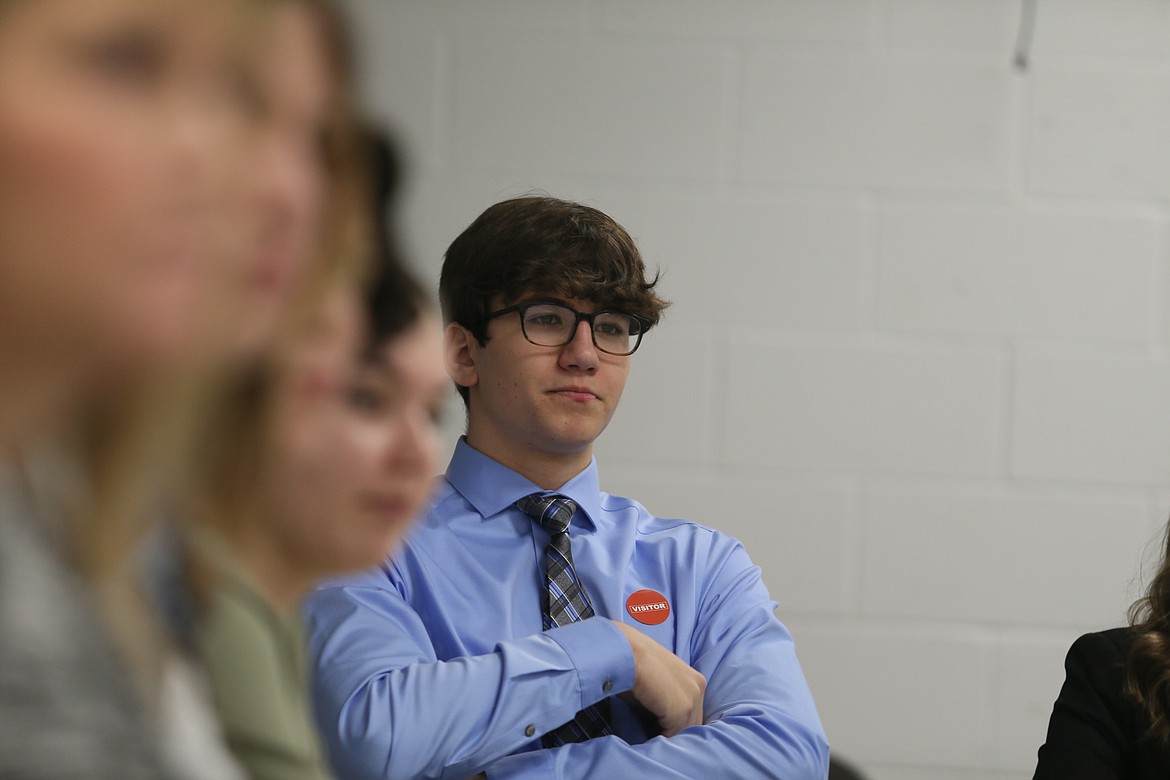 Timberlake senior Zachary Pasley listens Thursday morning as Gov. Brad Little speaks with local high schoolers in a roundtable format at Post Falls High.