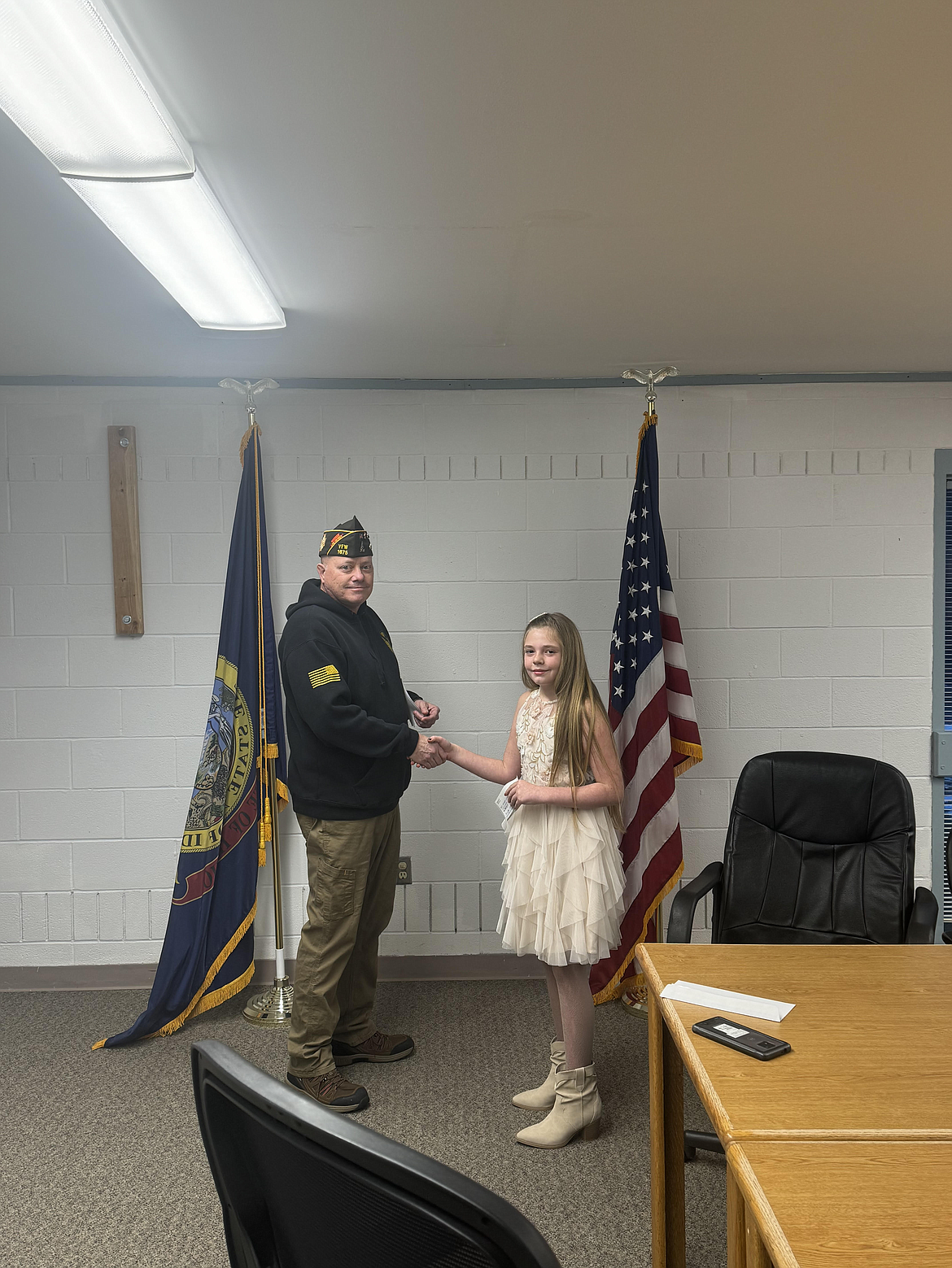 Natalie Willis is presented a local first place award for her Patriot's Pen essay by Osburn VFW commander Chris Marker.