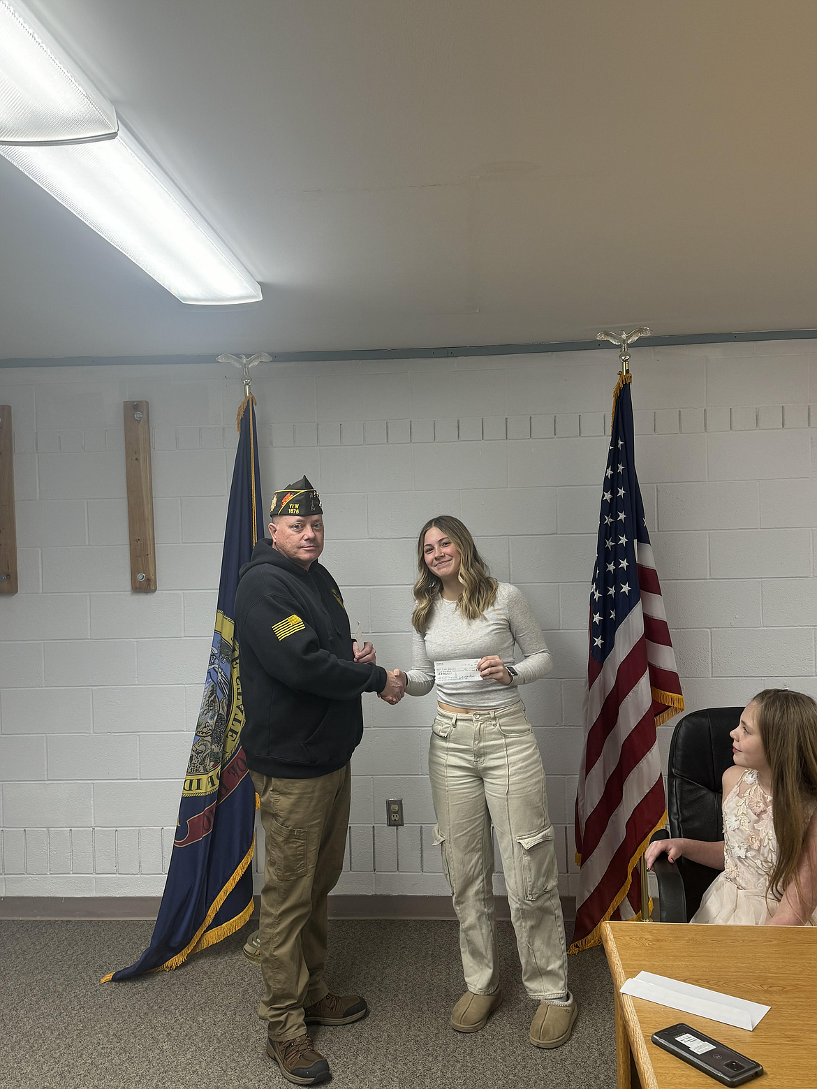 Zoe Brooks is presented a local first place award for her Voice of Democracy essay by Osburn VFW commander Chris Marker.