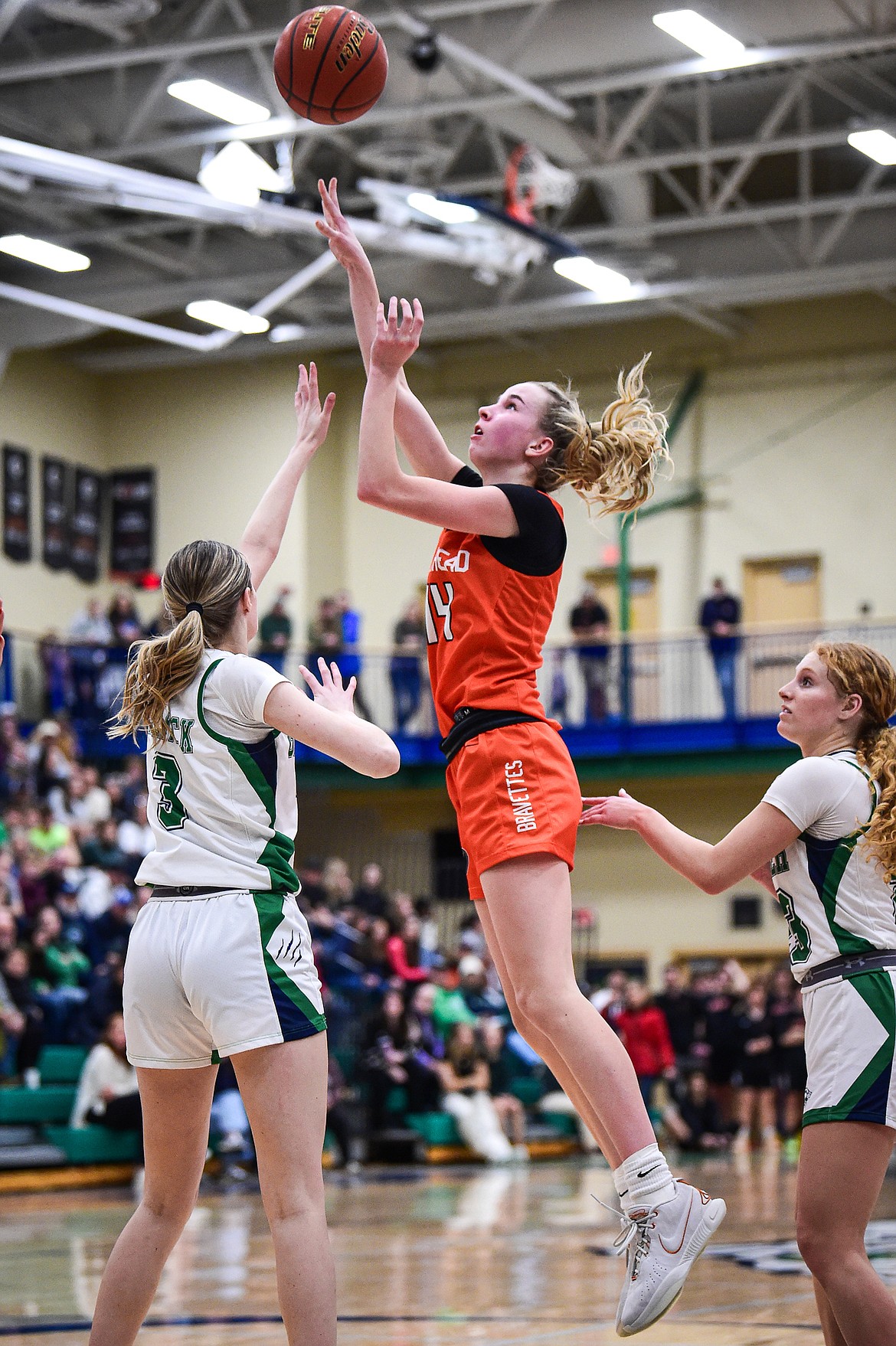 Flathead's Kennedy Moore (14) knocks down a jumper to take the lead late in the fourth quarter against Glacier at Glacier High School on Thursday, Feb. 1. (Casey Kreider/Daily Inter Lake)