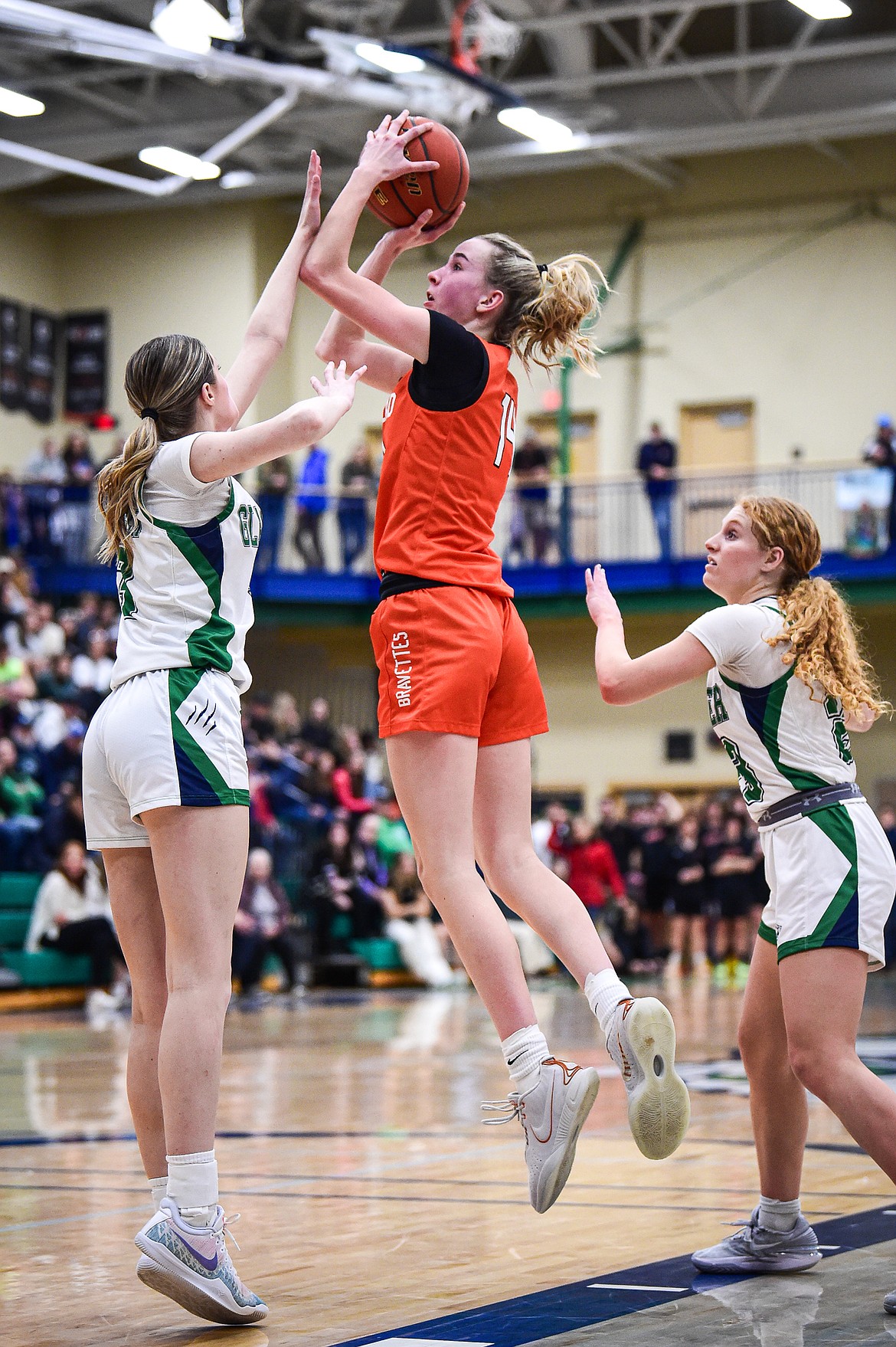 Flathead's Kennedy Moore (14) knocks down a jumper to take the lead late in the fourth quarter against Glacier at Glacier High School on Thursday, Feb. 1. (Casey Kreider/Daily Inter Lake)