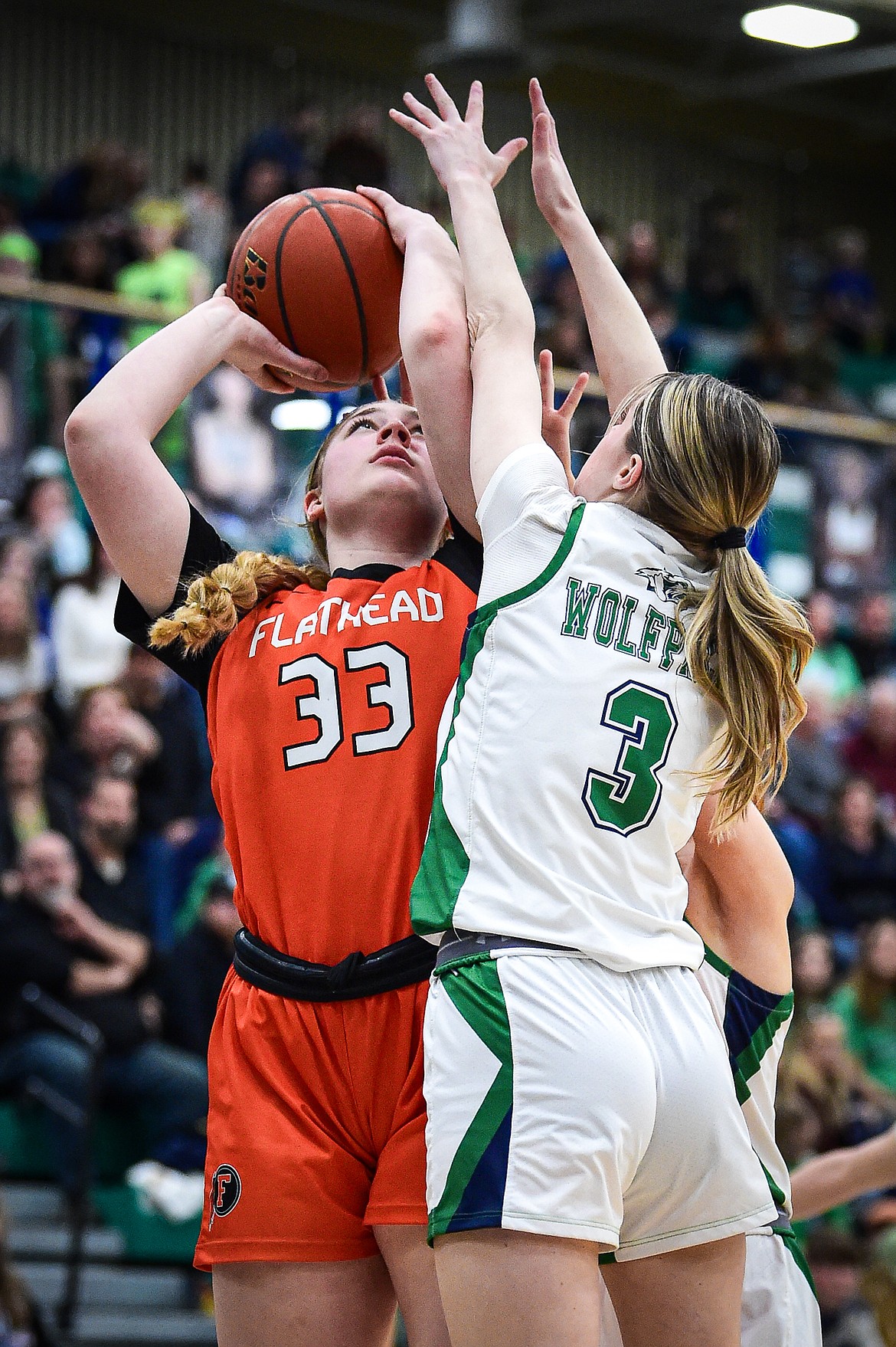 Flathead's Sami Dalager (33) goes to the basket guarded by Glacier's Jaidyn Pevey (3) in the fourth quarter at Glacier High School on Thursday, Feb. 1. (Casey Kreider/Daily Inter Lake)