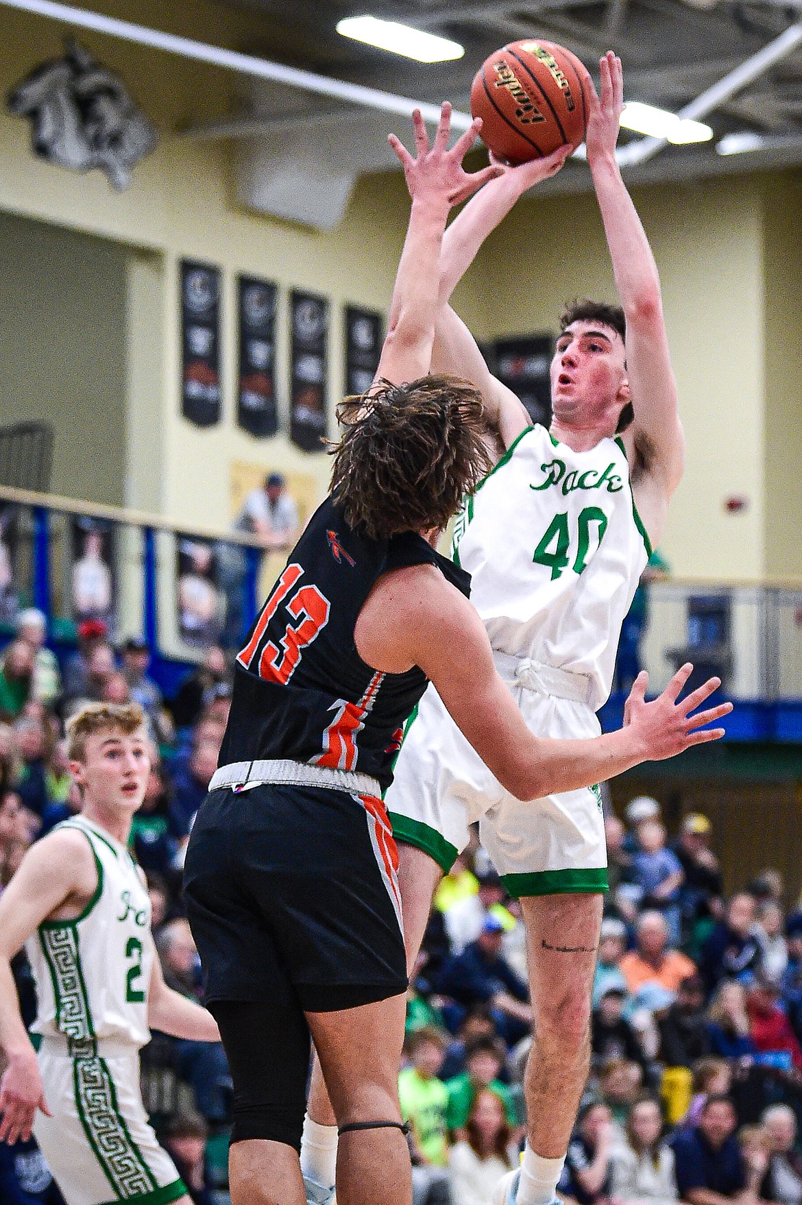 Glacier's Noah Cummings (40) shoots guarded by Flathead's Lyric Ersland (13) in the first half at Glacier High School on Thursday, Feb. 1. (Casey Kreider/Daily Inter Lake)