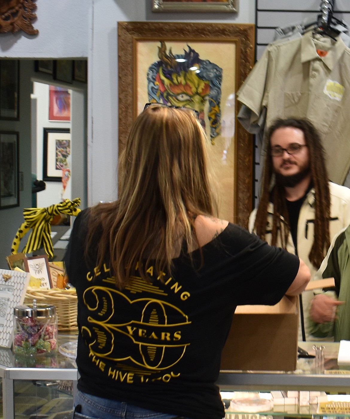 Besides bee-themed tattoos, there were T-shirts and stickers on sale to commemorate Moses Lake’s oldest tattoo parlor turning 30 Friday.