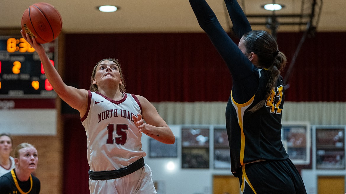 NIC ATHLETICS
North Idaho College freshman Maddie Williamson drives to the basket as Southern Idaho's Taylor Johnson defends during the first half of Saturday's Scenic West Athletic Conference game at Rolly Williams Court.