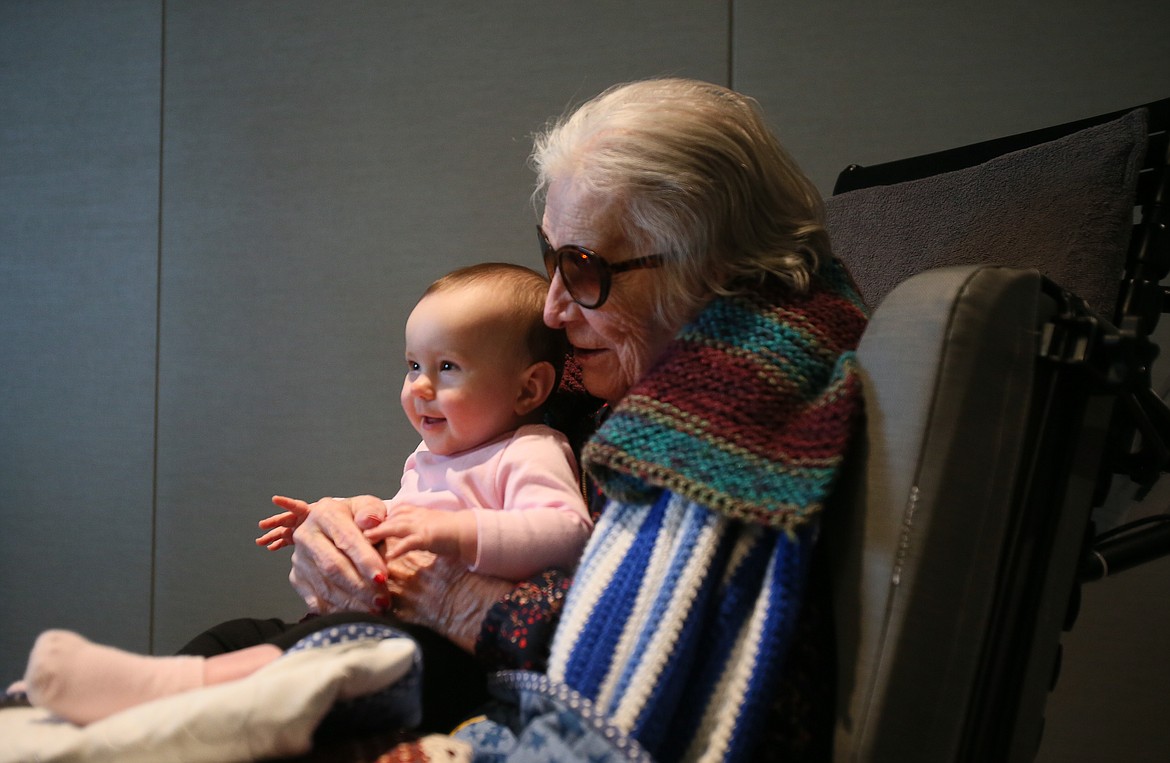 The youngest member of the family, Kinsley Sather, 8 months, shares a special moment with the eldest of the family, great-grandmother Alice Flesher, 102, at the Idaho State Veterans Home in Post Falls. Flesher was a nurse in World War II and was recognized with a Quilt of Honor on her 102nd birthday, which was Saturday.