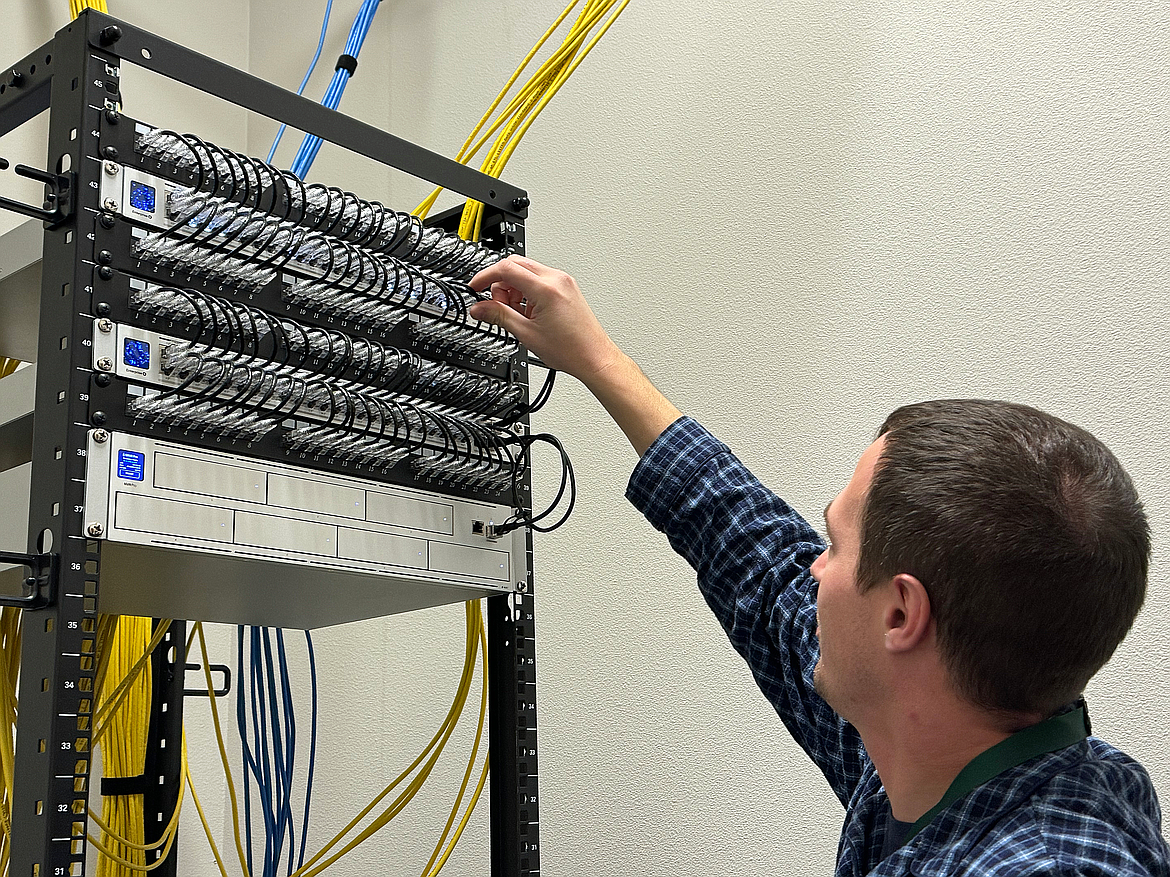 Brendan Mooney, East Bonner County Library District's IT manager, checks over one of the library's computer servers. Improvements to the system are just some of the technology upgrades being made to improve services, network stability and security, and more.