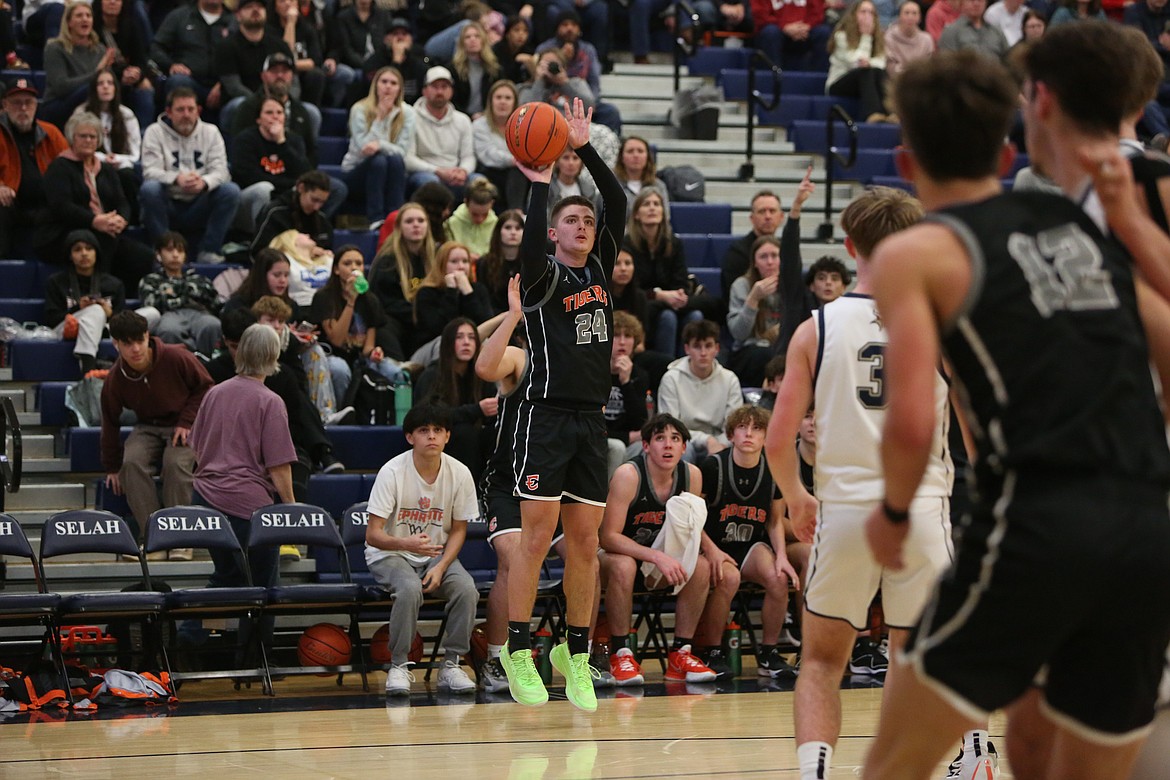 Ephrata senior Cody Black (24) attempts a three-pointer in the third quarter against Selah.